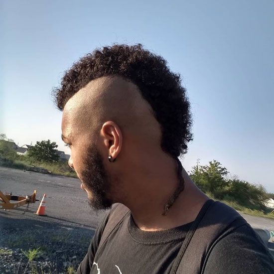 Afro-textured Mohawk With Bald Fade