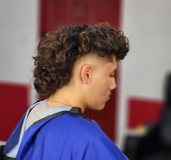 Elevated Curly Mullet with Sharp Mid-fade